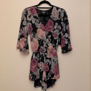 Lulu’s WHAT'S BLOOMIN' BLACK FLORAL PRINT ROMPER
